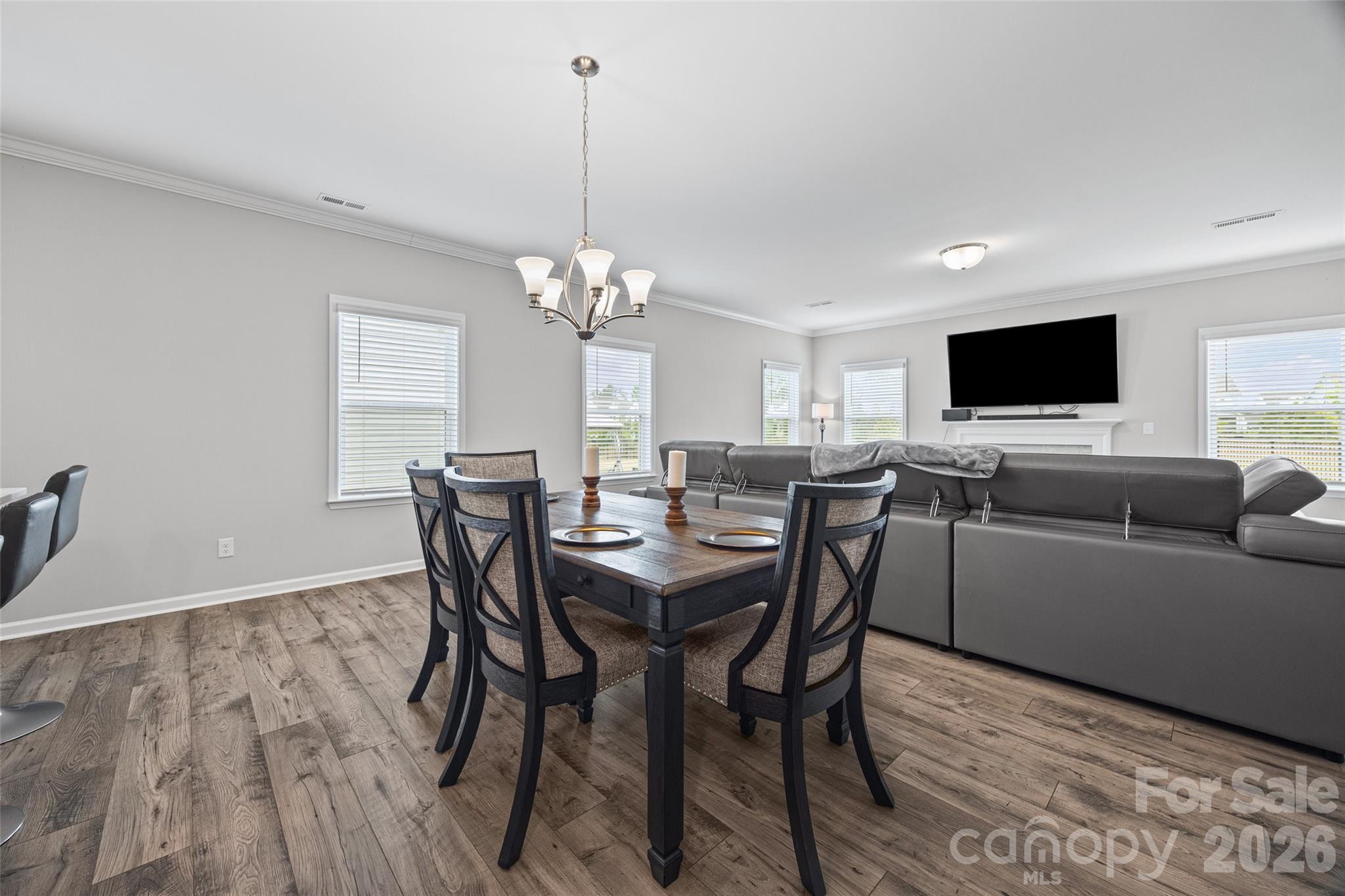 12000 Sam Snead Court Lancaster, SC 29720 - Photo 10 of 36 a view of a dining room with furniture and wooden floor