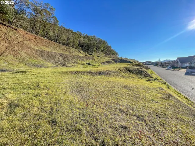 a view of a large body of water with a building in the background