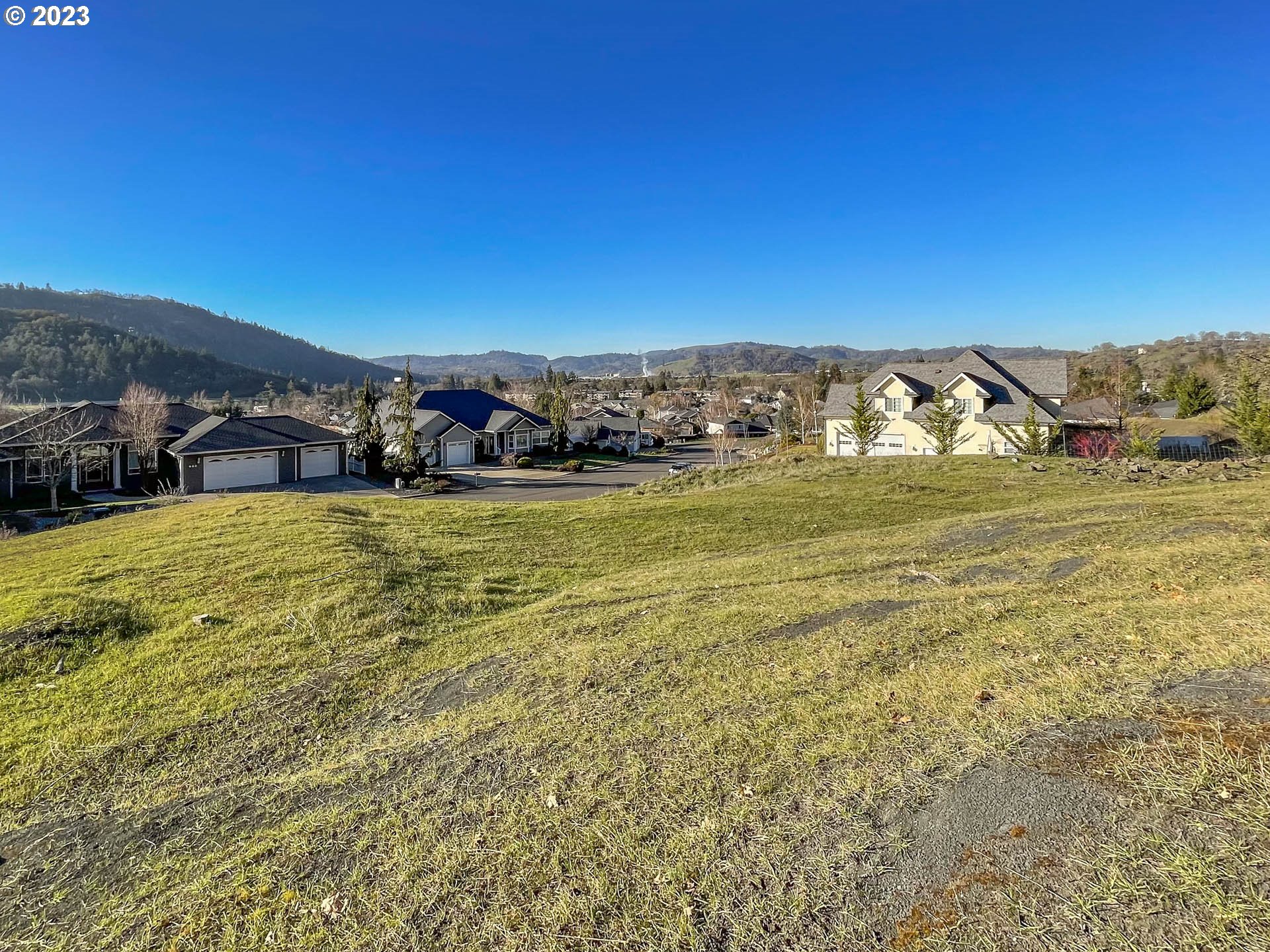 817 North View Drive Winchester, OR 97495 - Photo 8 of 11 a view of a large body of water with a building in the background