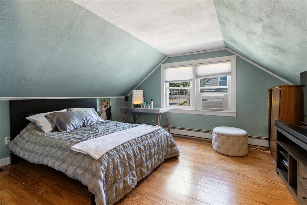63 Baldwin Road Billerica, MA 01821 - Photo 20 of 38 a bedroom with a bed and a window
