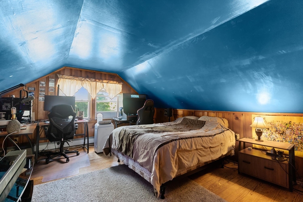 63 Baldwin Road Billerica, MA 01821 - Photo 23 of 38 a bedroom with a bed a chair and a large window