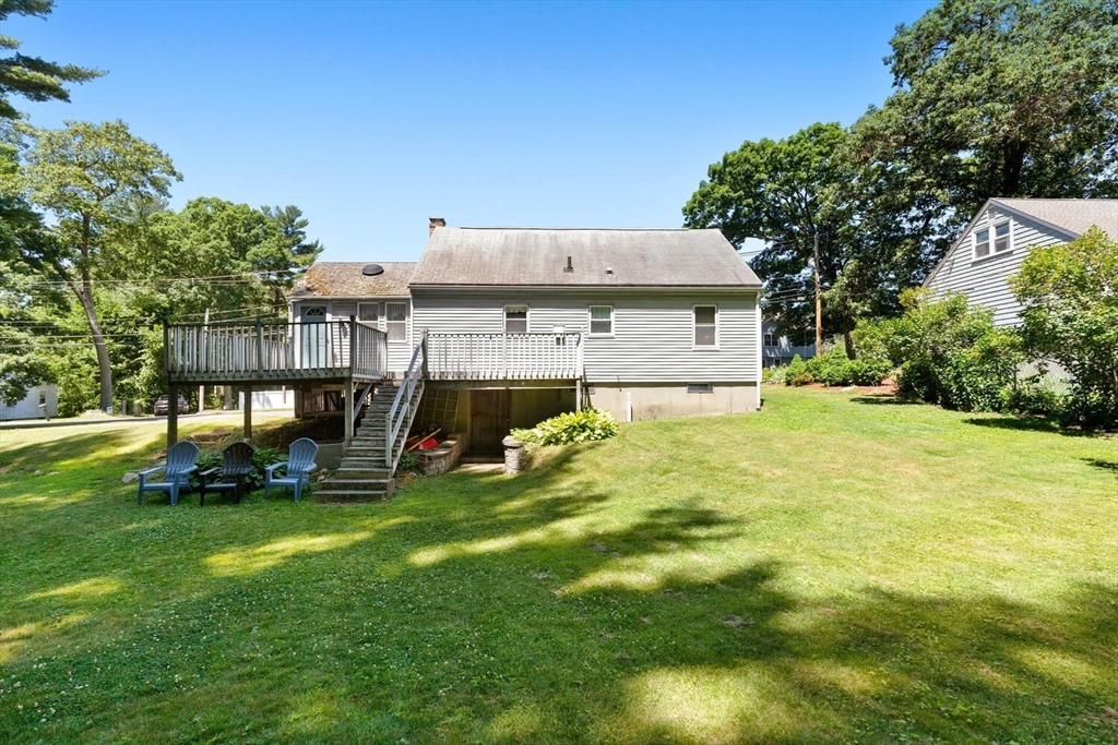 63 Baldwin Road Billerica, MA 01821 - Photo 32 of 38 a view of a house with a yard and sitting area