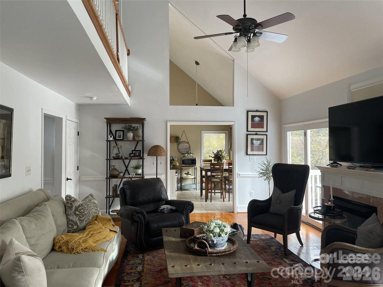3800 Oldfield Road Charlotte, NC 28226 - Photo 4 of 32 a living room with furniture and a flat screen tv