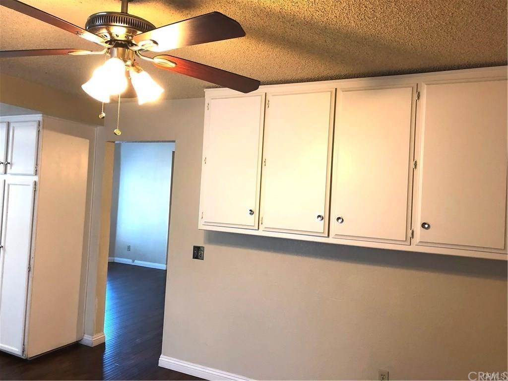 632 North Birch Avenue Rialto, CA 92376 - Photo 11 of 24 a view of an empty room with window and wooden floor