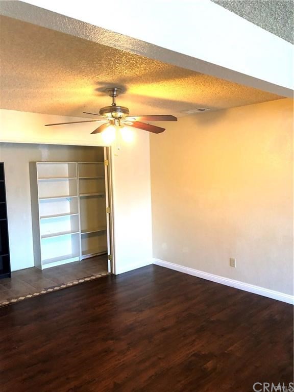 632 North Birch Avenue Rialto, CA 92376 - Photo 12 of 24 a view of a room with wooden floor and a window