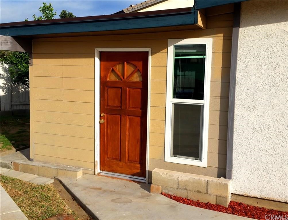 632 North Birch Avenue Rialto, CA 92376 - Photo 14 of 24 a front view of a house with a yard