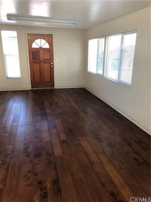 632 North Birch Avenue Rialto, CA 92376 - Photo 15 of 24 an empty room with wooden floor and windows