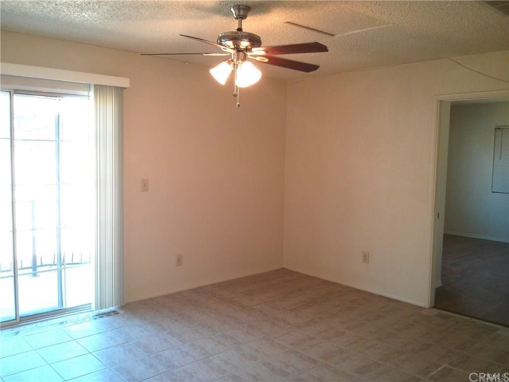 632 North Birch Avenue Rialto, CA 92376 - Photo 16 of 24 an empty room with windows and fan