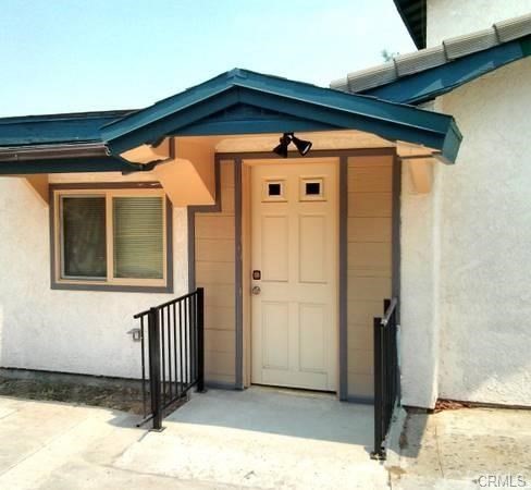 632 North Birch Avenue Rialto, CA 92376 - Photo 9 of 24 a view of a house with wooden fence