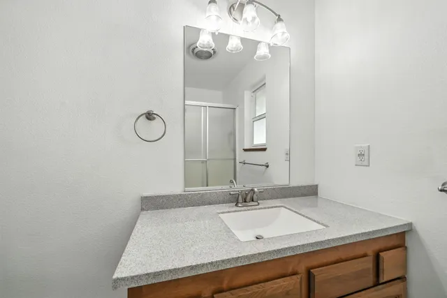 a bathroom with a sink and a mirror
