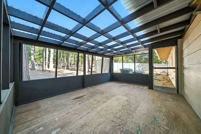 a view of an empty room with a balcony