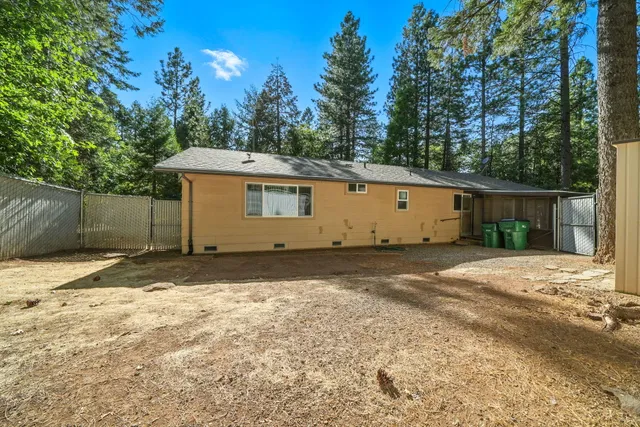 a view of a backyard of the house