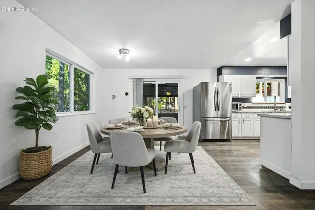 a view of a dining room with furniture window and wooden floor