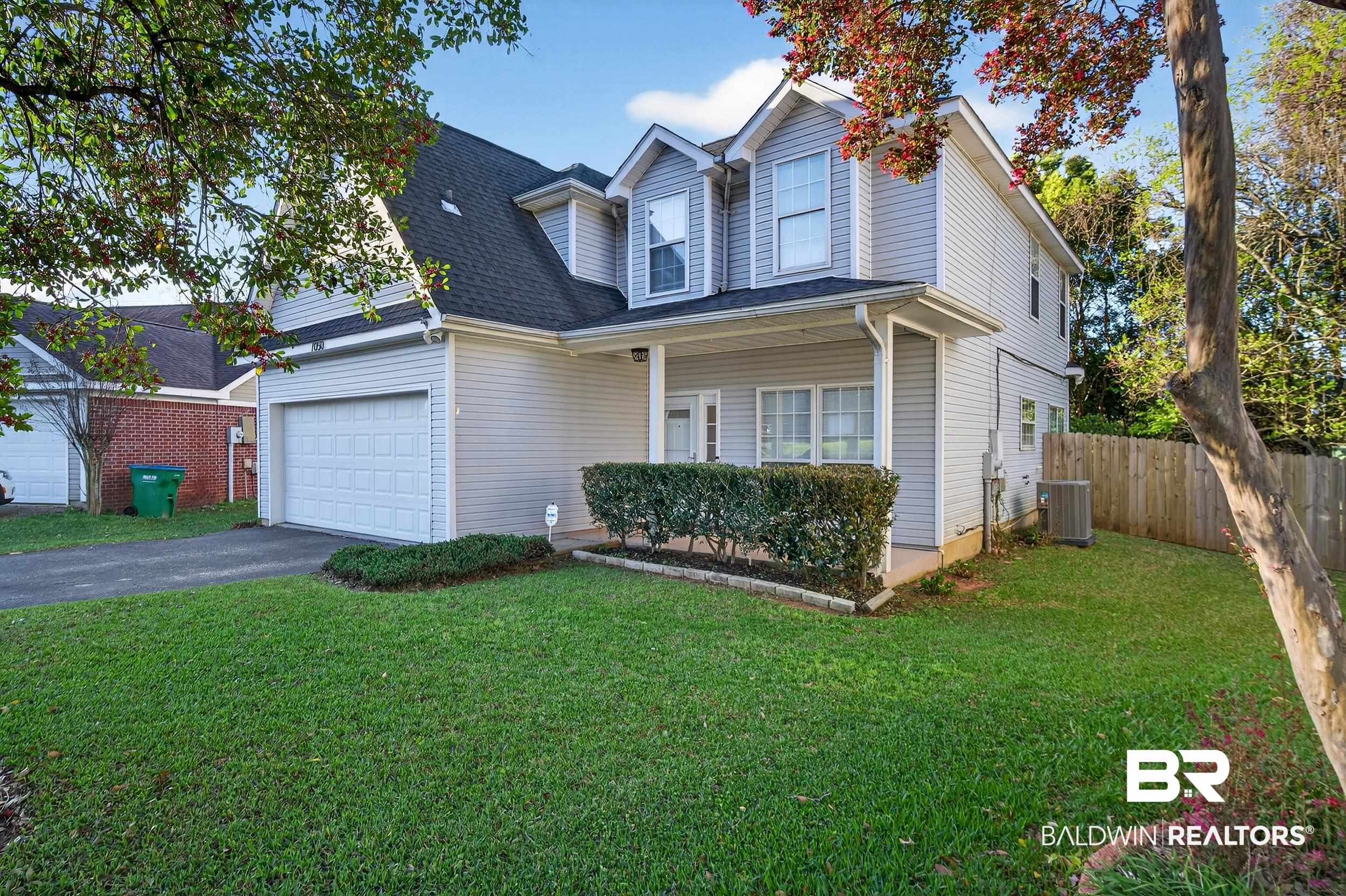 7050 Highpointe Place West Daphne, AL 36527 - Photo 4 of 66 Traditional home with a porch, asphalt driveway, an attached garage, and roof with shingles