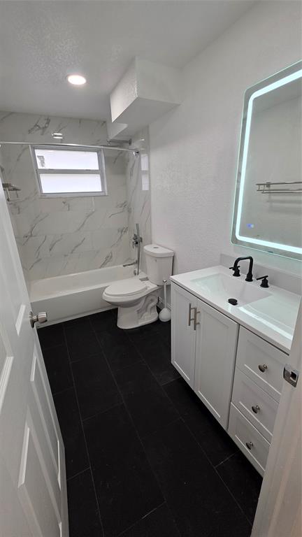 5332 Northwest 18th Street, Unit 2A Lauderhill, FL 33313 - Photo 7 of 13 a bathroom with a double vanity sink a toilet and a mirror