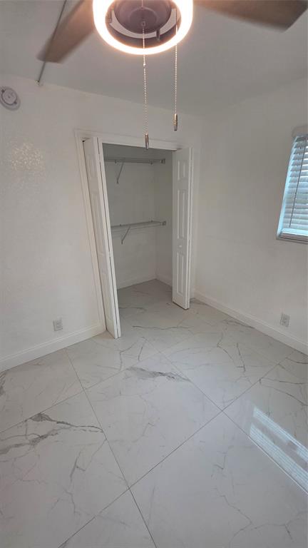 5332 Northwest 18th Street, Unit 2A Lauderhill, FL 33313 - Photo 9 of 13 a view of an empty room with a window