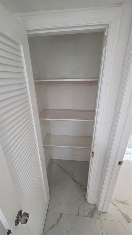 5332 Northwest 18th Street, Unit 2A Lauderhill, FL 33313 - Photo 10 of 13 a view of walk in closet with empty racks