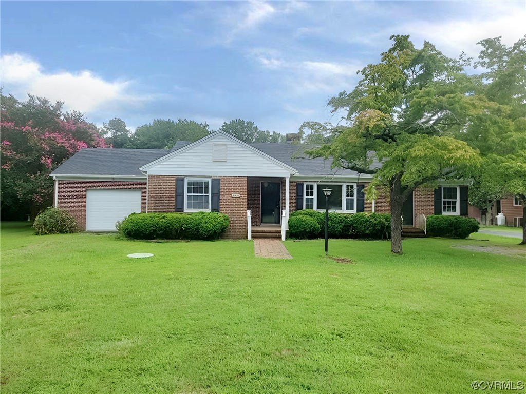 2631 White Chapel Road Lancaster, VA 22503 - Photo 1 of 19 a front view of a house with a garden