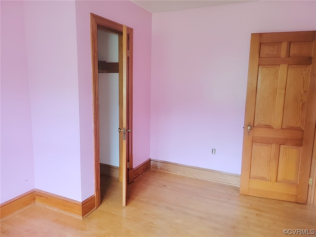 2631 White Chapel Road Lancaster, VA 22503 - Photo 10 of 19 an empty room with a door