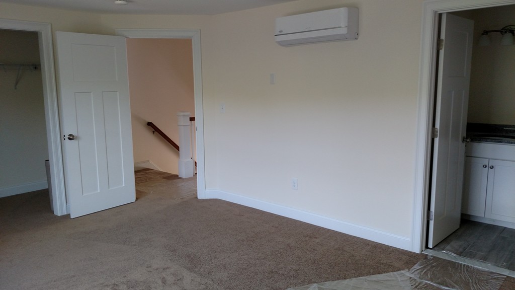 213 Main Street, Unit 2 Maynard, MA 01754 - Photo 3 of 10 a view of a livingroom with wooden floor