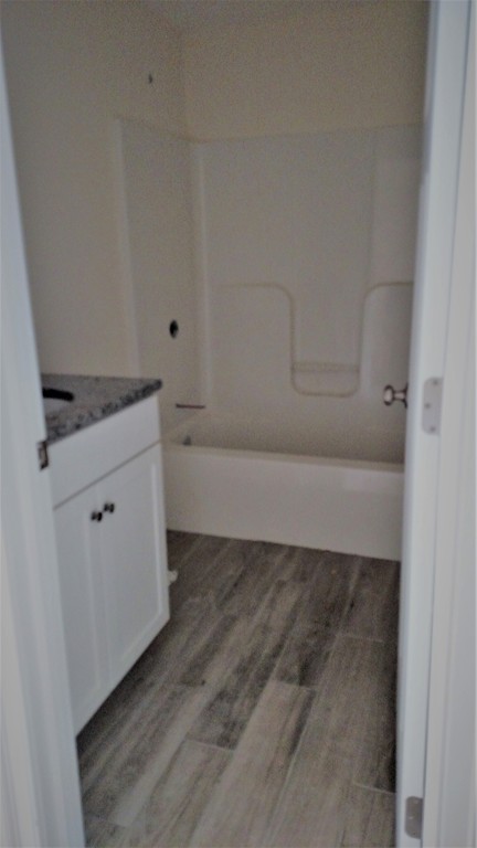 213 Main Street, Unit 2 Maynard, MA 01754 - Photo 4 of 10 a view of cabinets and wooden floor