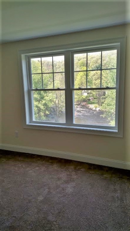 213 Main Street, Unit 2 Maynard, MA 01754 - Photo 10 of 10 a view of an empty room with a window