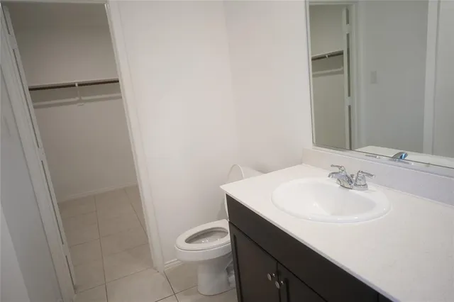 a bathroom with a toilet and a sink
