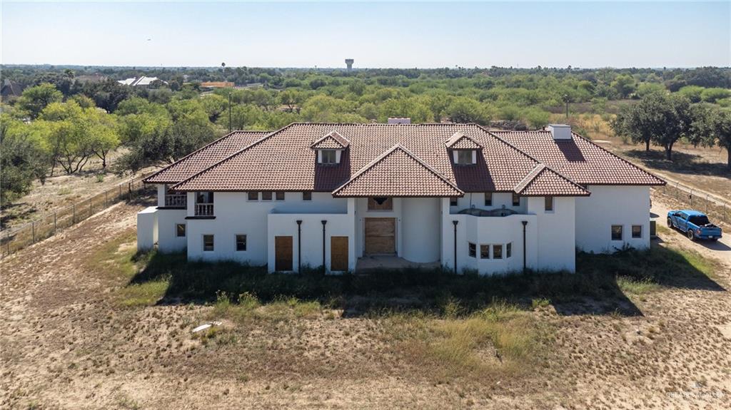 2136 East Mile 3 Road Palmhurst, TX 78573 - Photo 1 of 18 an aerial view of a house with a yard