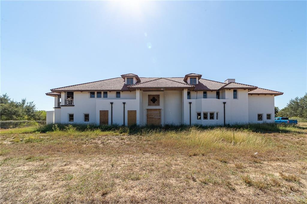 2136 East Mile 3 Road Palmhurst, TX 78573 - Photo 2 of 18 a front view of a house with a yard