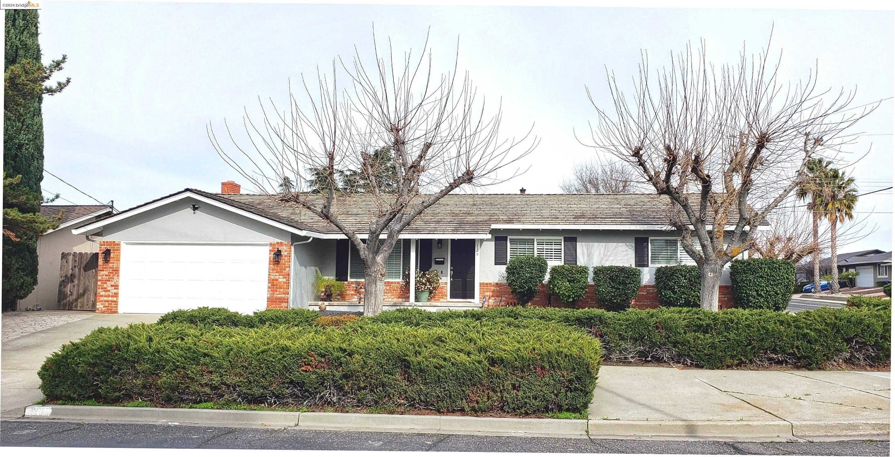 front view of a house with a small yard