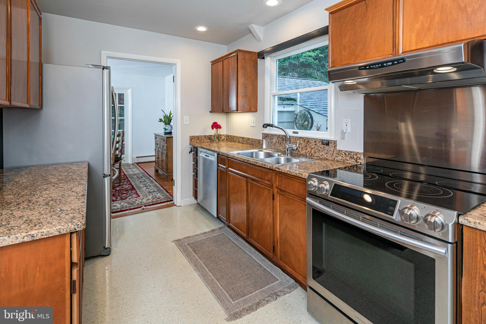 63 North Mill Road Princeton Junction, NJ 08550 - Photo 11 of 29 a kitchen with stainless steel appliances granite countertop a stove and a refrigerator