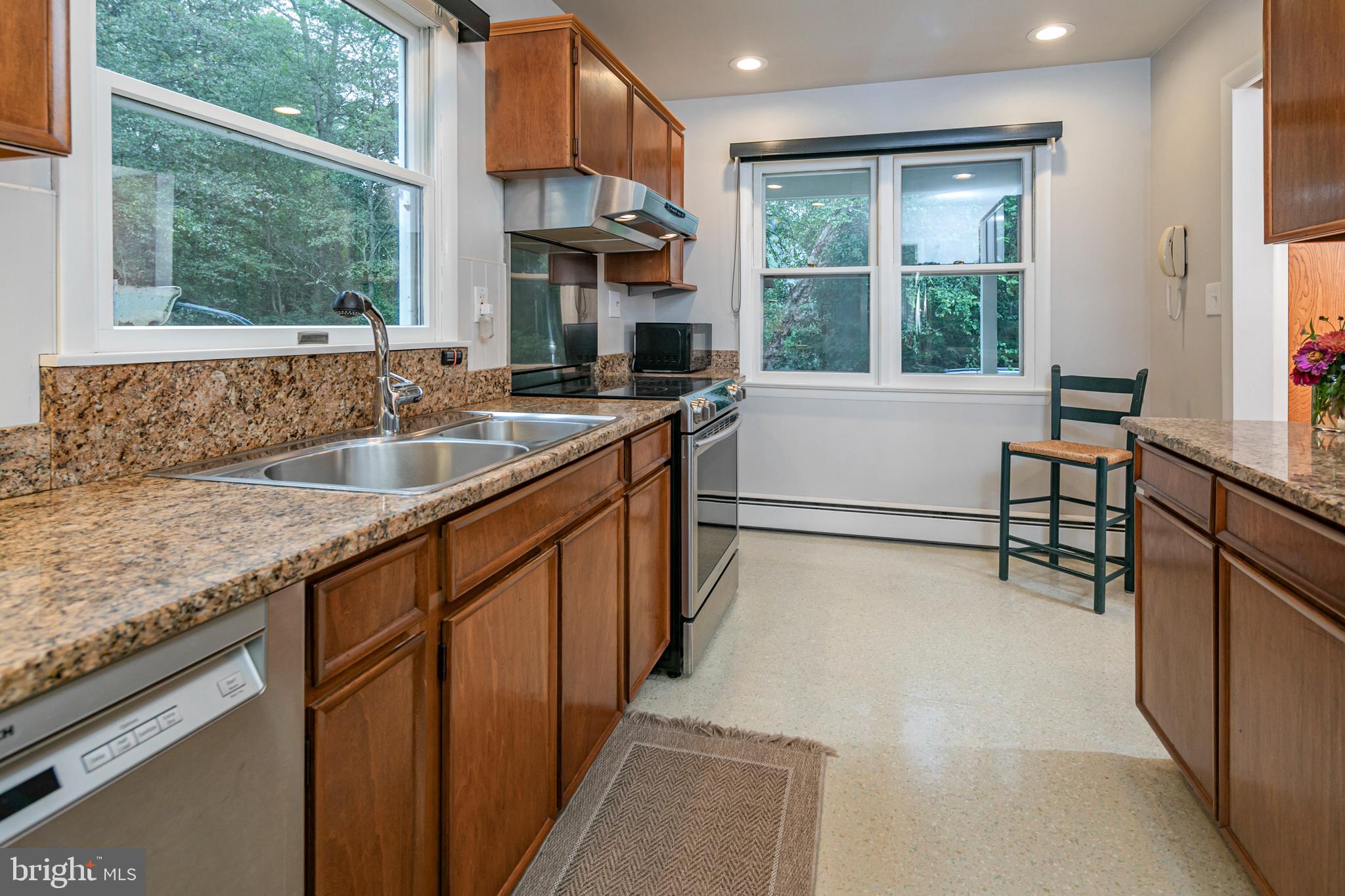 63 North Mill Road Princeton Junction, NJ 08550 - Photo 12 of 29 a kitchen with granite countertop a sink and a refrigerator