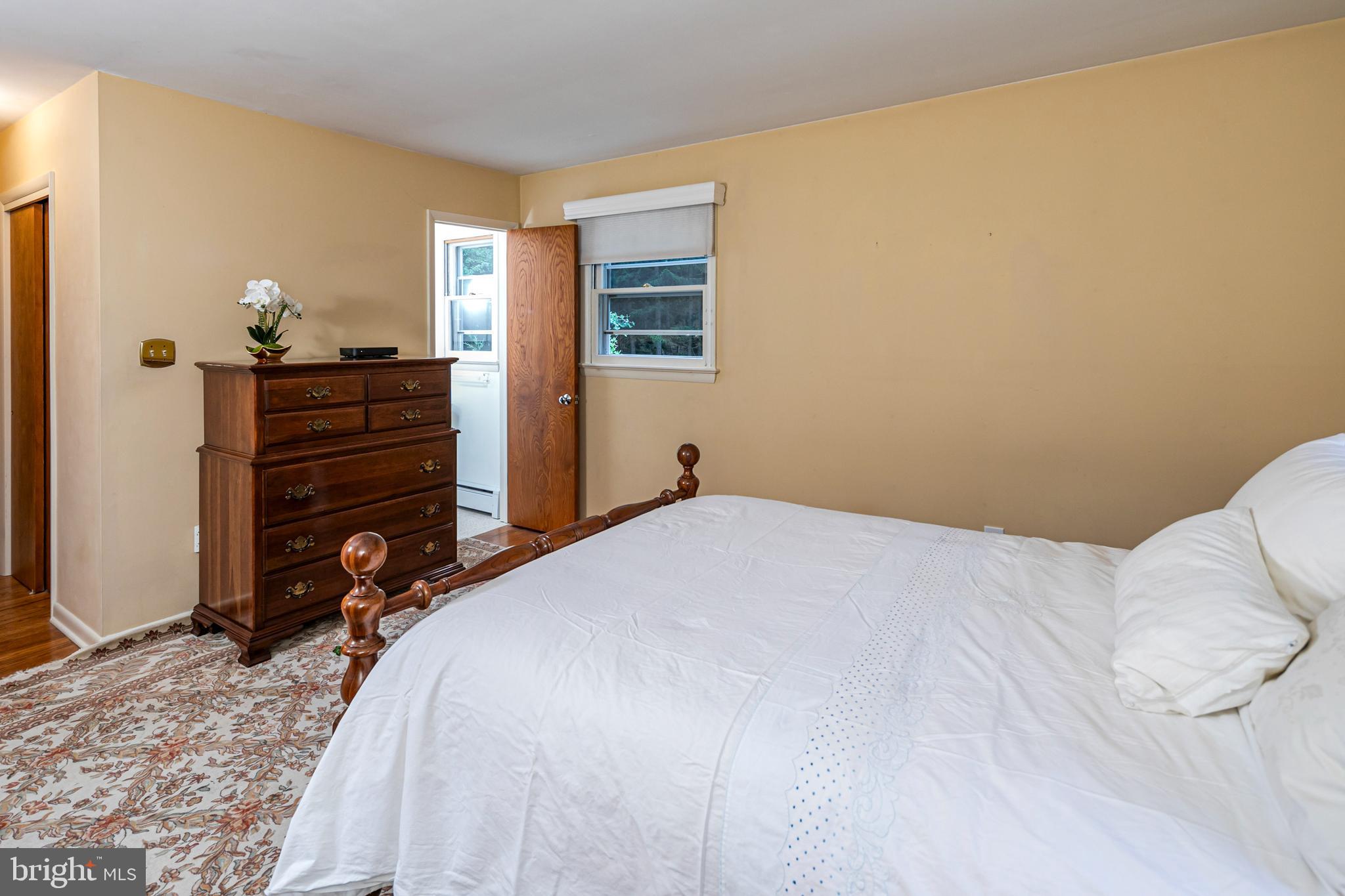 63 North Mill Road Princeton Junction, NJ 08550 - Photo 18 of 29 a bedroom with a bed and wooden floor