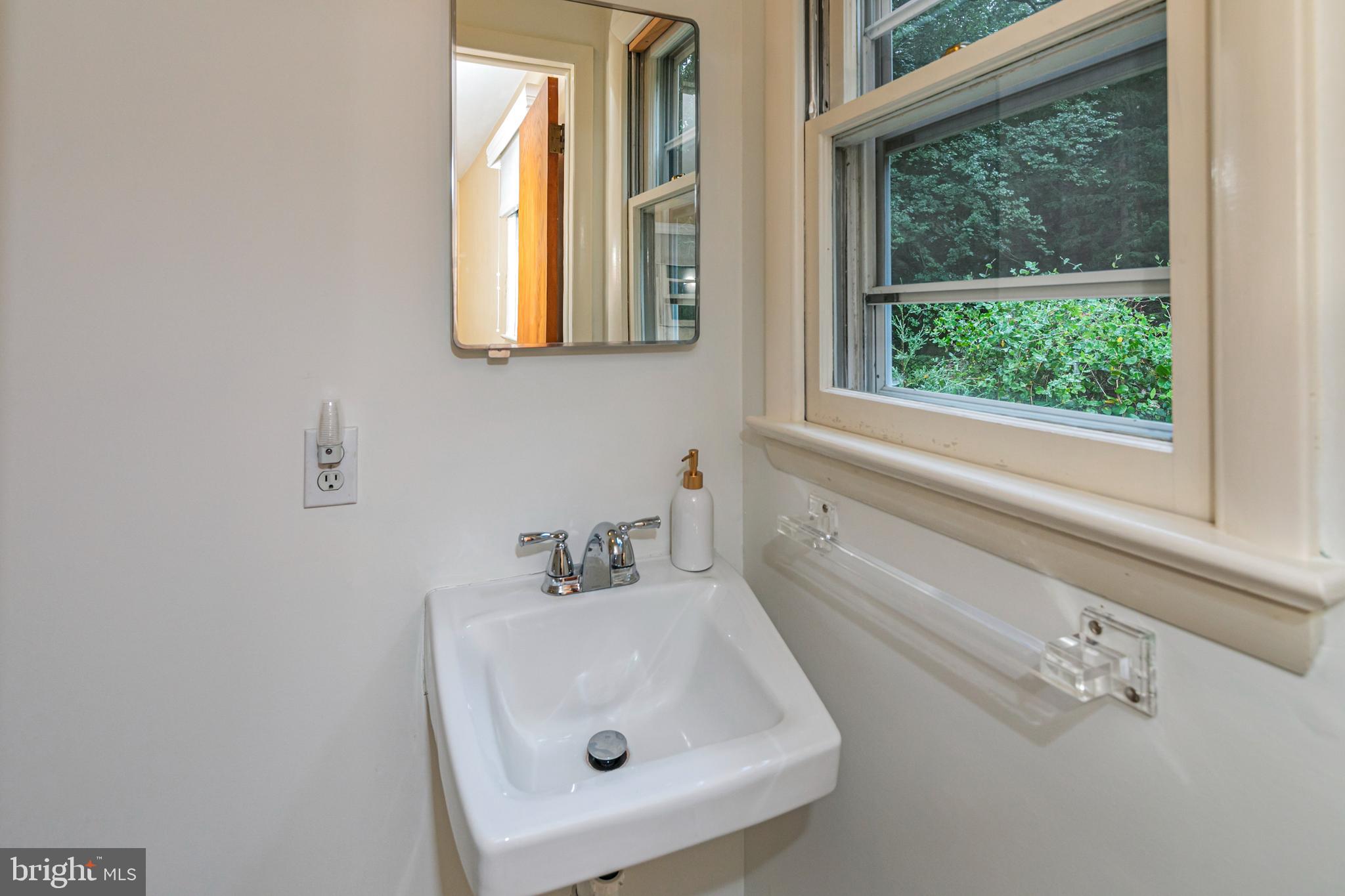63 North Mill Road Princeton Junction, NJ 08550 - Photo 19 of 29 a bathroom with a sink and a mirror