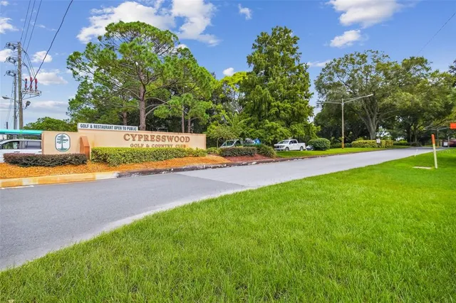 a view of a swimming pool with an outdoor space and seating area