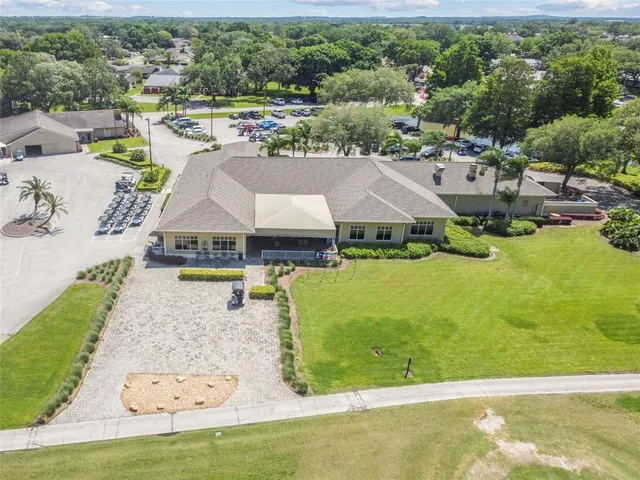 an aerial view of a house with a swimming pool