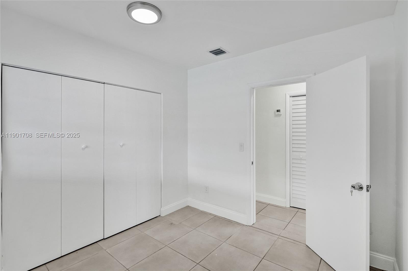 5750 Northwest 111th Street Hialeah, FL 33012 - Photo 22 of 34 a view of an empty room