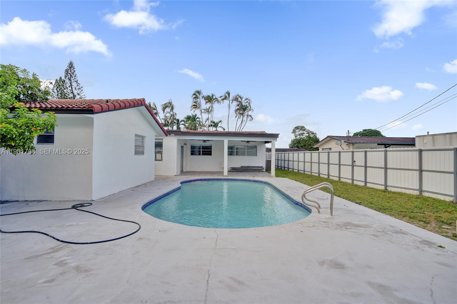 5750 Northwest 111th Street Hialeah, FL 33012 - Photo 27 of 34 a view of a swimming pool with a yard and plants