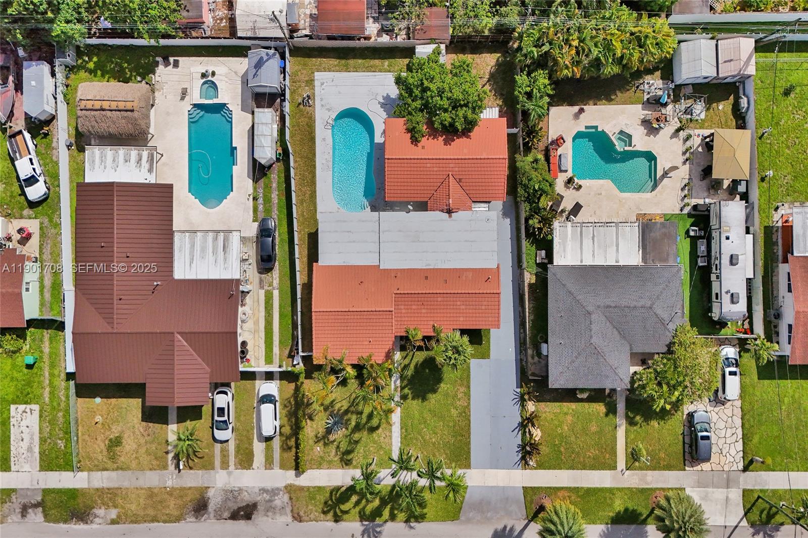 5750 Northwest 111th Street Hialeah, FL 33012 - Photo 32 of 34 an aerial view of houses with outdoor space