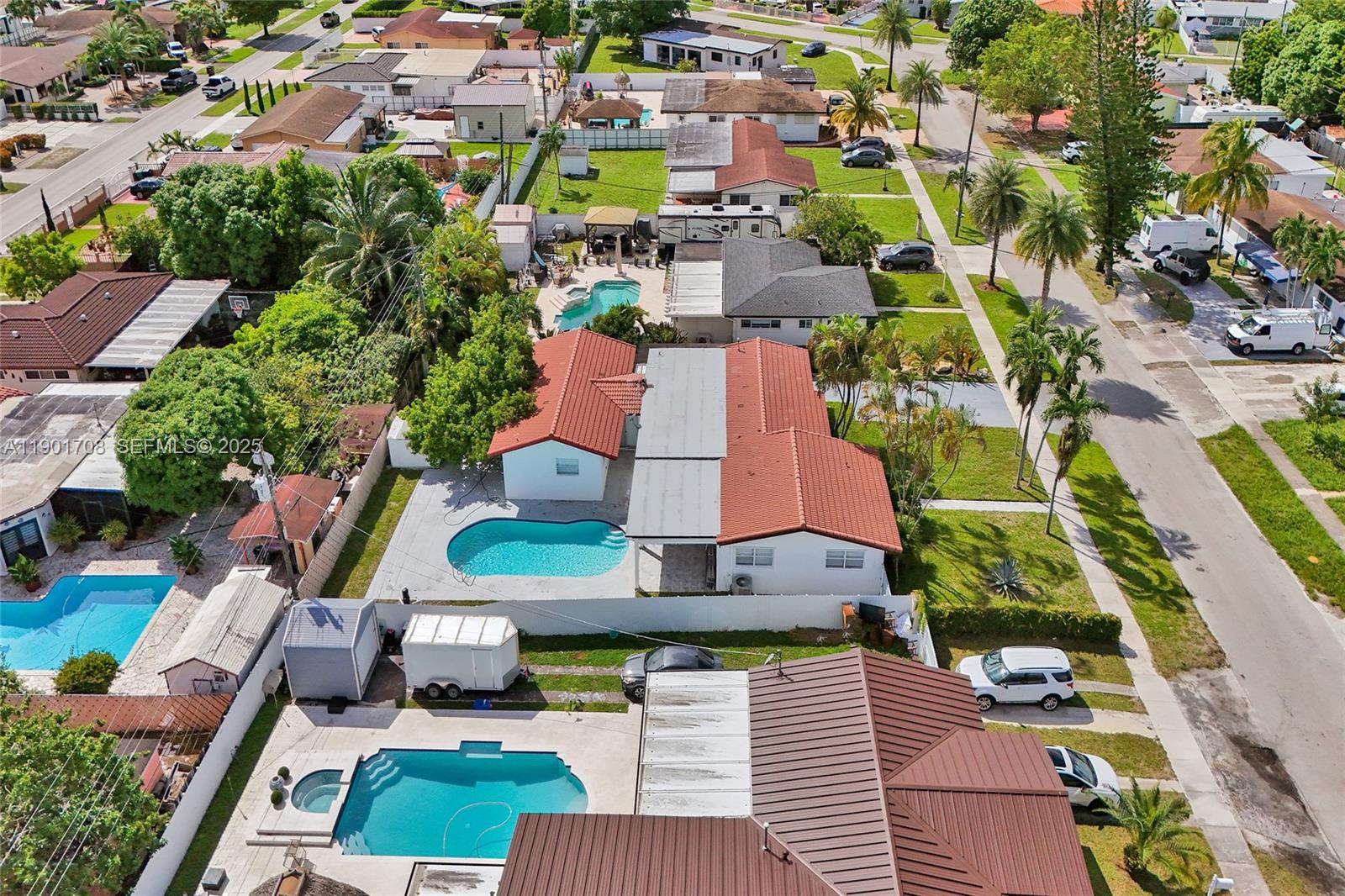 5750 Northwest 111th Street Hialeah, FL 33012 - Photo 33 of 34 an aerial view of residential houses with outdoor space