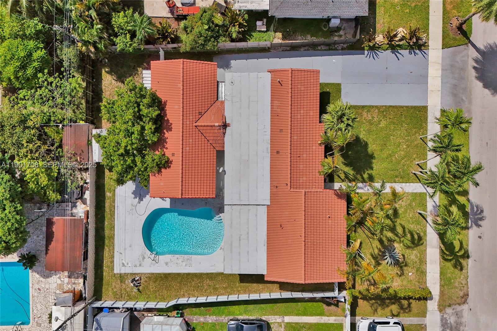5750 Northwest 111th Street Hialeah, FL 33012 - Photo 34 of 34 an aerial view of residential house with outdoor space and swimming pool
