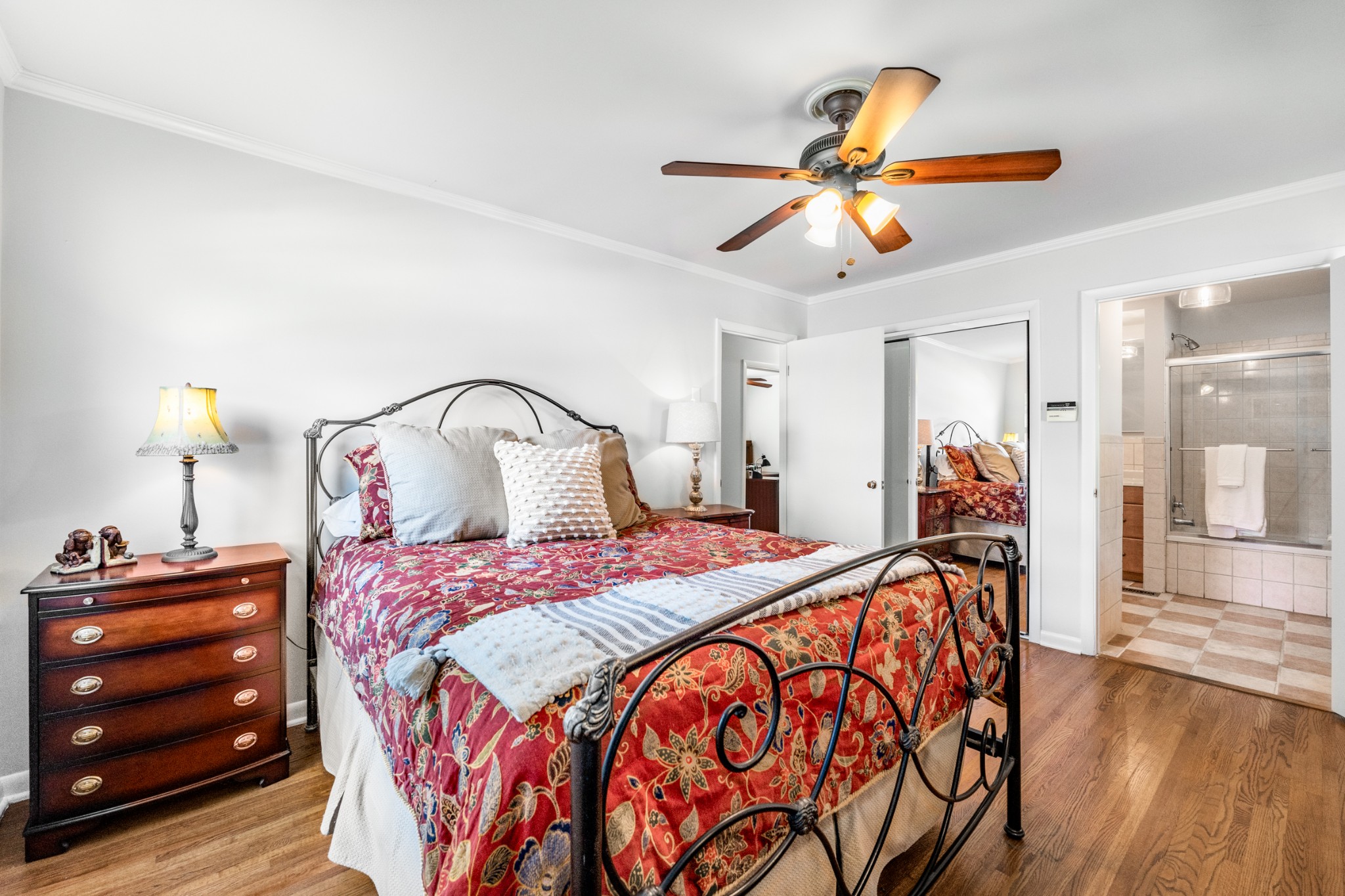 5123 Regent Drive Nashville, TN 37220 - Photo 15 of 29 a bedroom with a bed and a chandelier