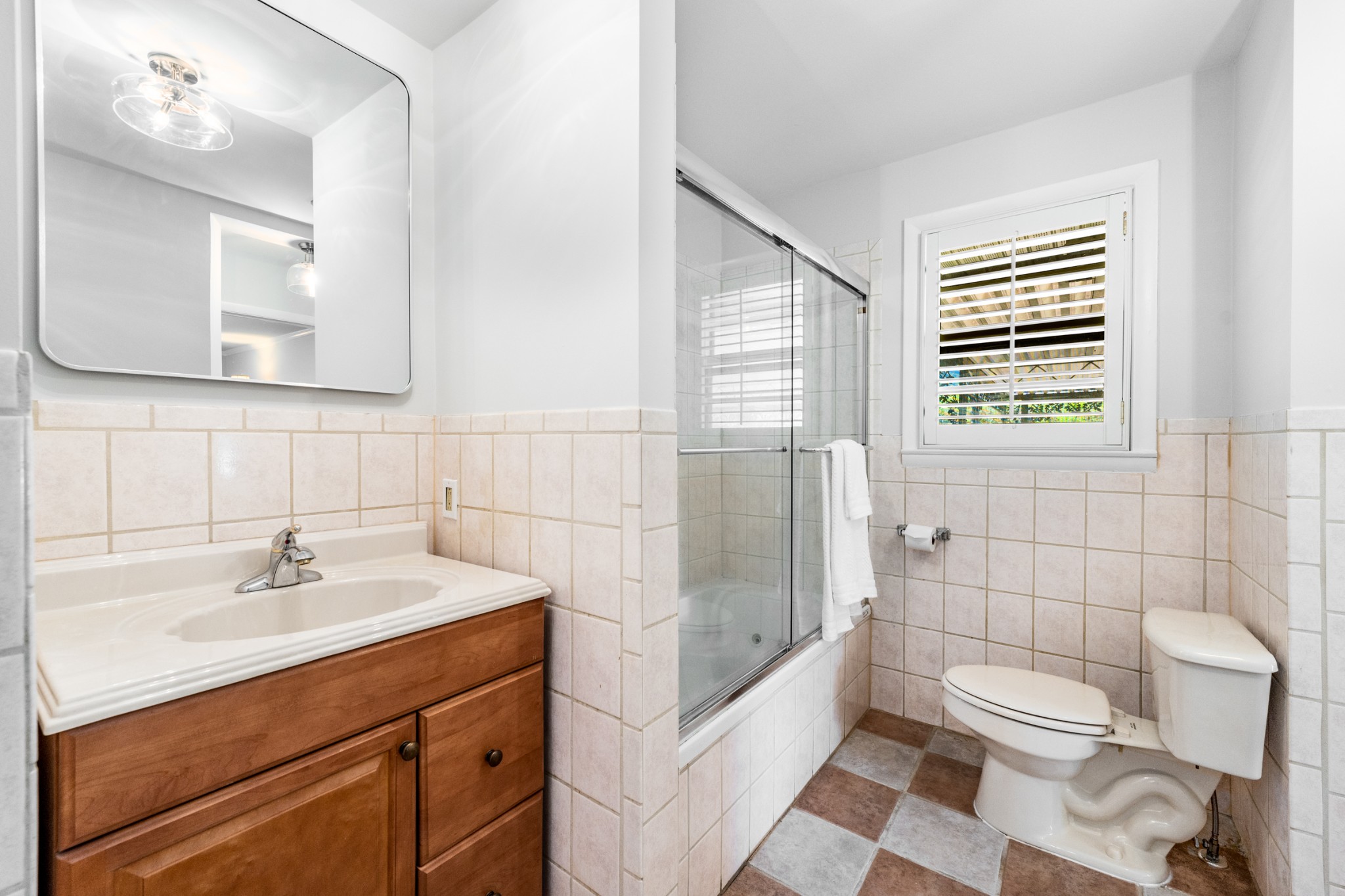 5123 Regent Drive Nashville, TN 37220 - Photo 17 of 29 a bathroom with a sink toilet a mirror and shower