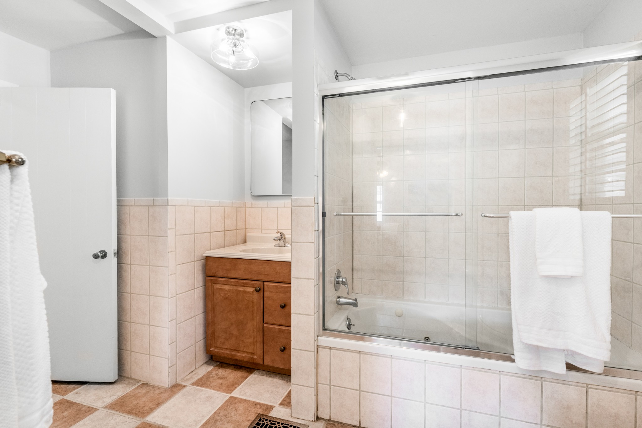 5123 Regent Drive Nashville, TN 37220 - Photo 18 of 29 a bathroom with a bathtub and shower