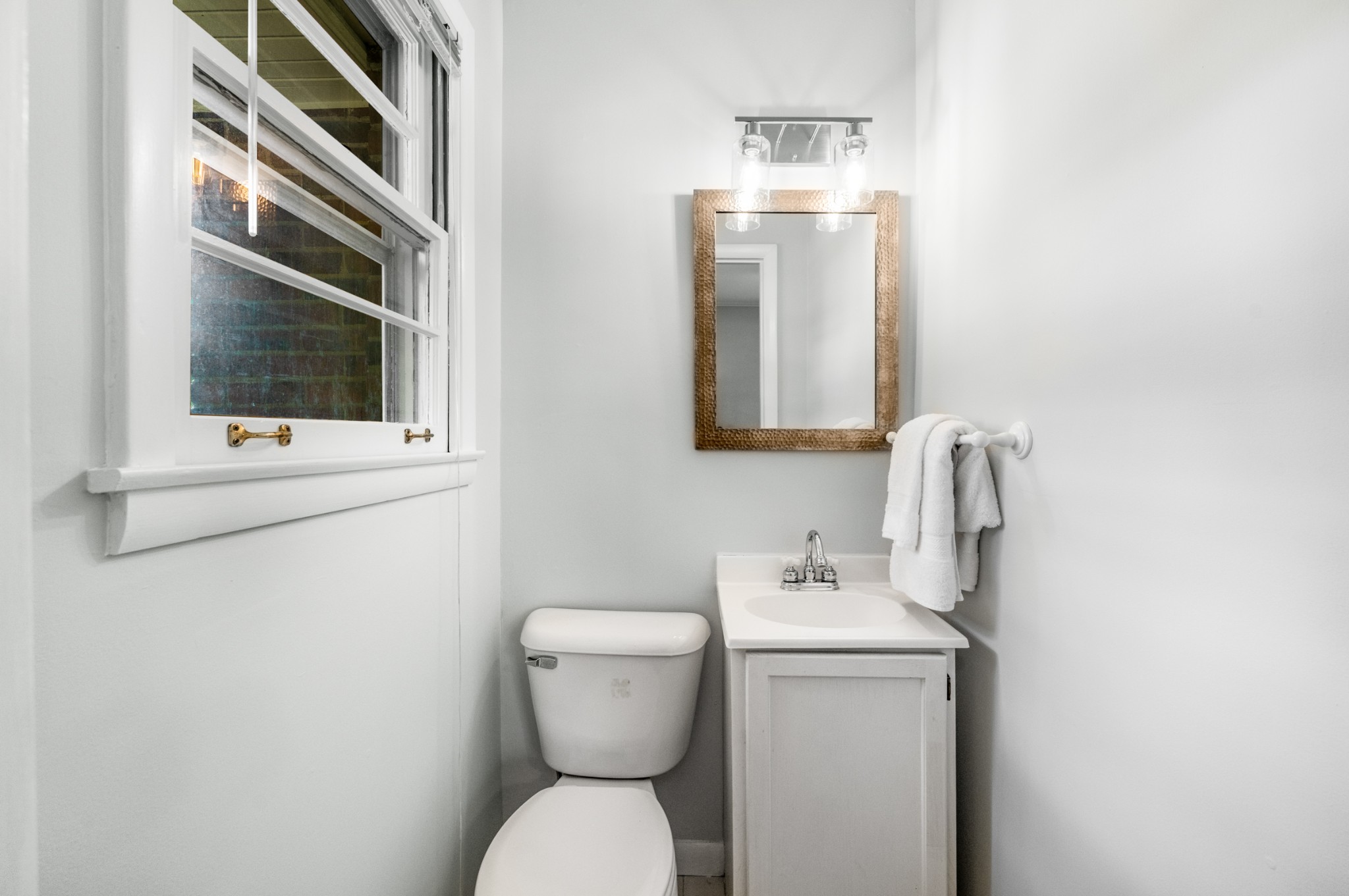 5123 Regent Drive Nashville, TN 37220 - Photo 20 of 29 a bathroom with a toilet sink and mirror
