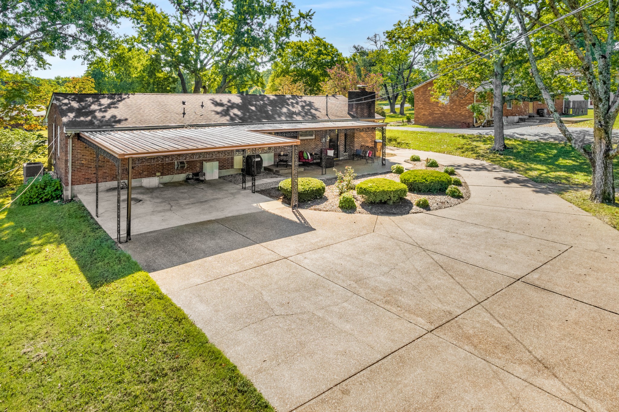 5123 Regent Drive Nashville, TN 37220 - Photo 23 of 29 a view of a patio with table and chairs under an umbrella
