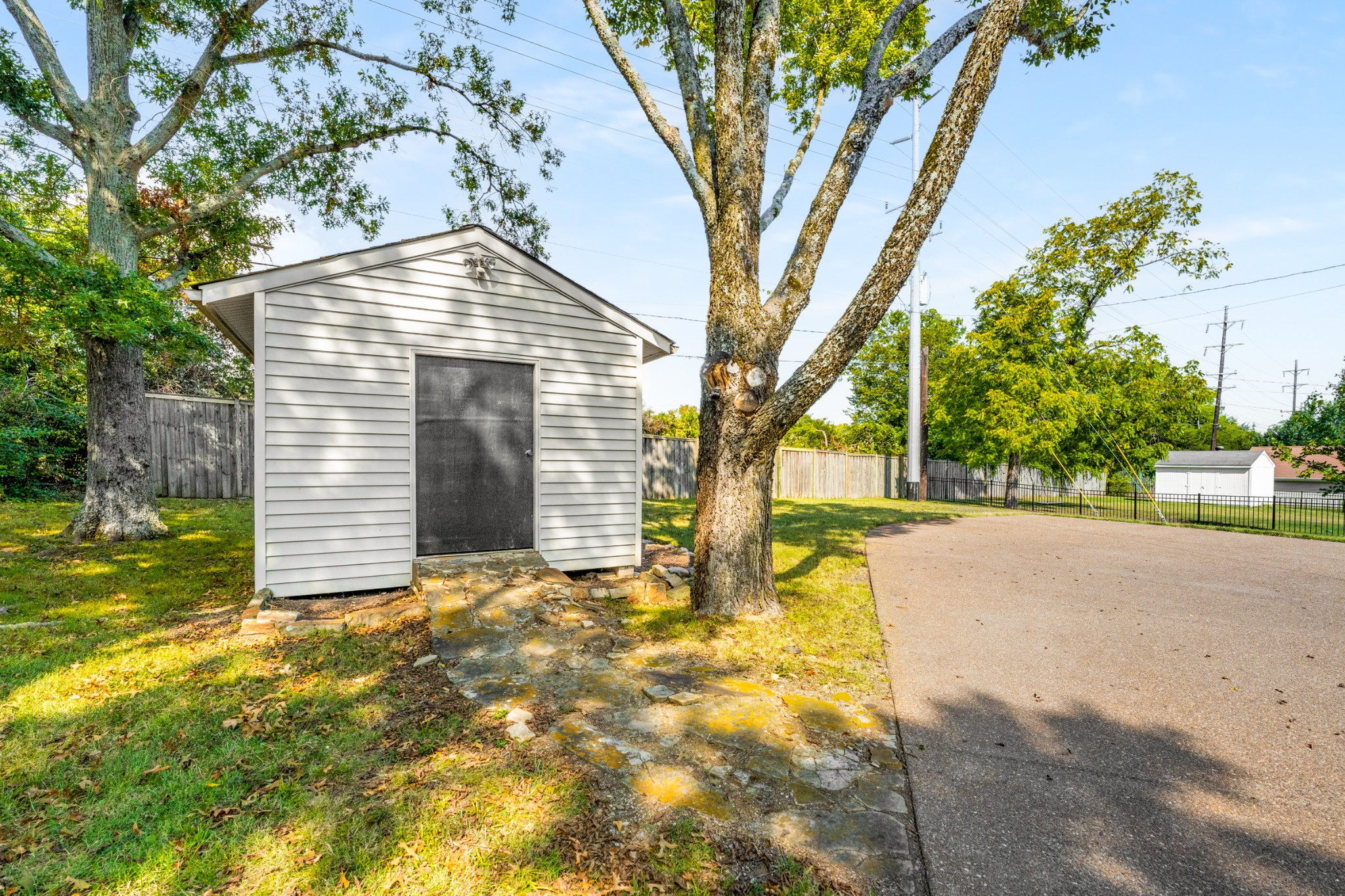 5123 Regent Drive Nashville, TN 37220 - Photo 26 of 29 a view of yellow house with large tree and wooden fence