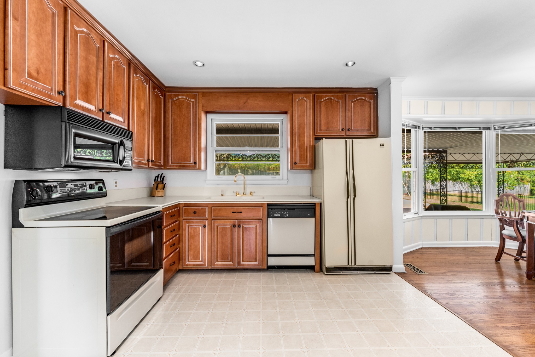 5123 Regent Drive Nashville, TN 37220 - Photo 10 of 29 a kitchen with stainless steel appliances granite countertop a refrigerator a stove a sink and a microwave