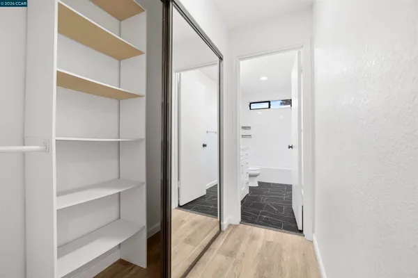 a view of a walk in closet and bedroom