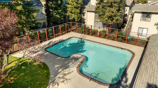 a view of a swimming pool with a balcony